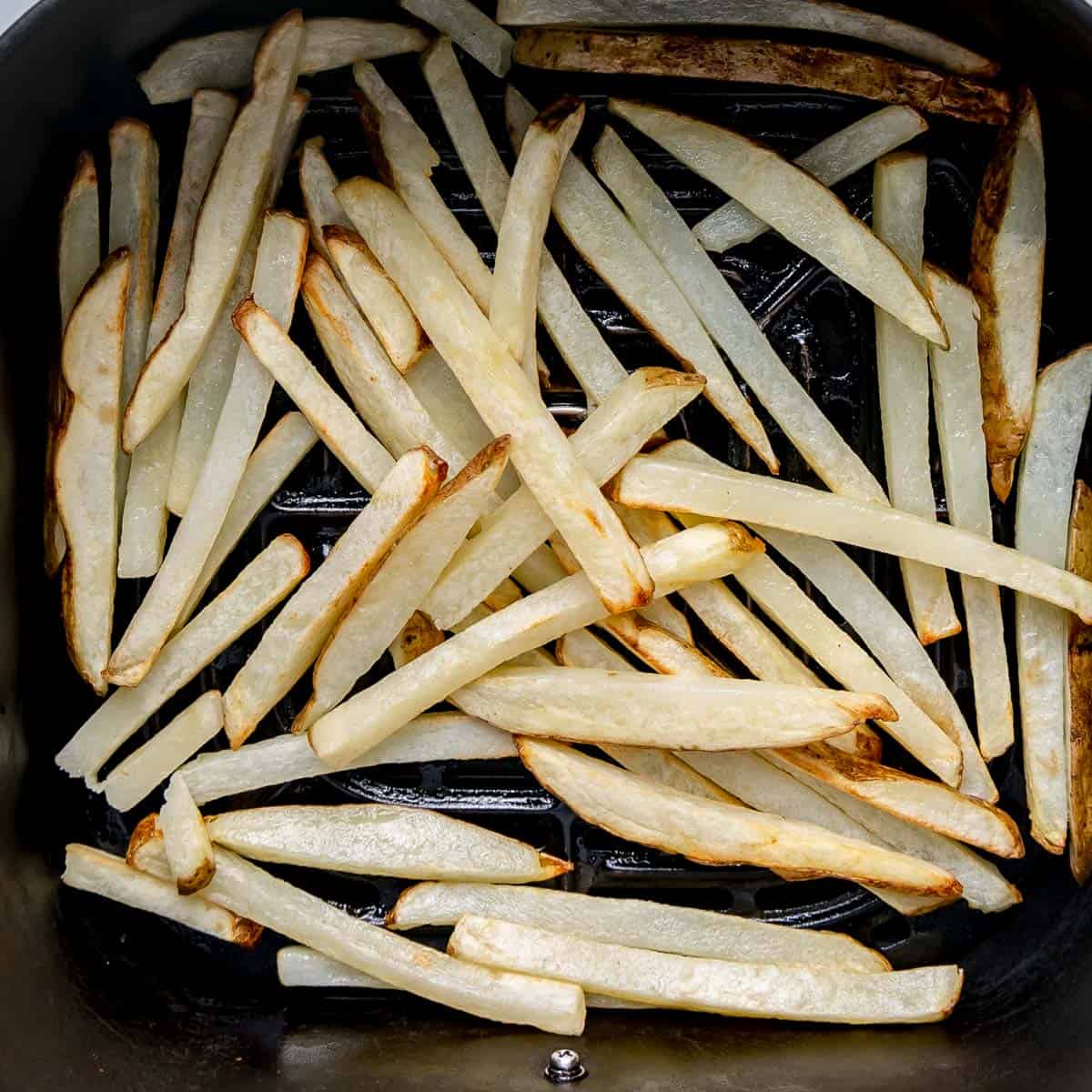 Fries in the air fryer basket.