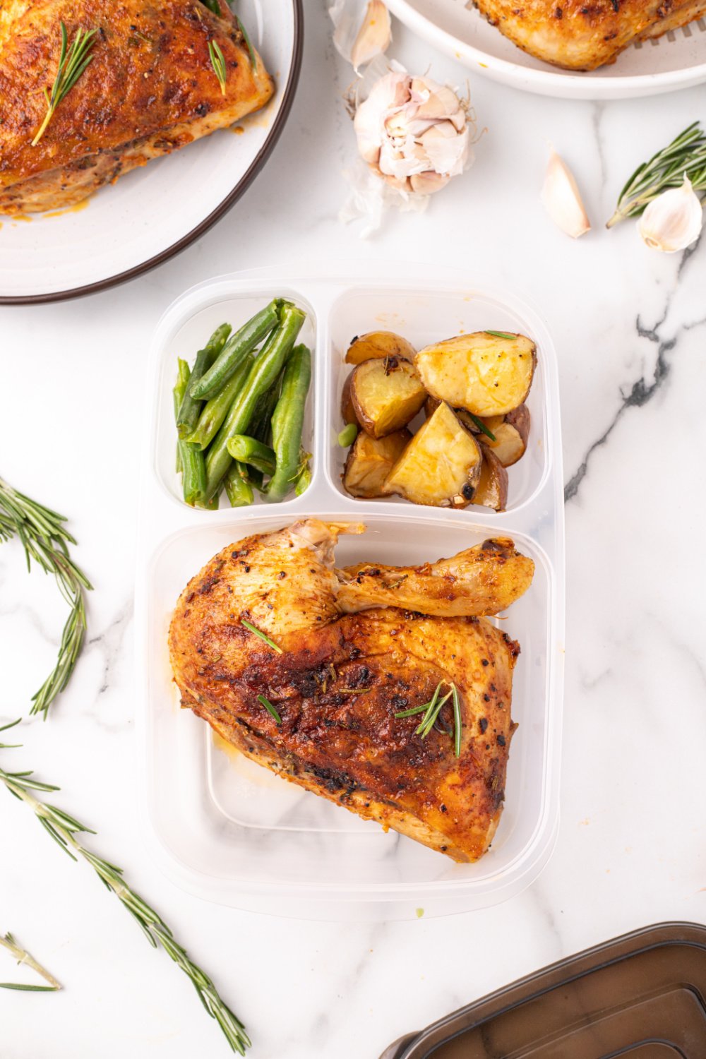 Rosemary Garlic Chicken Quarter packed in a lunchbox