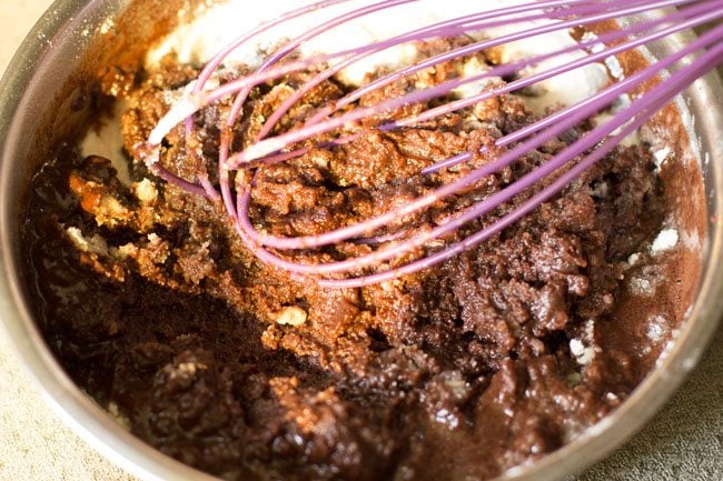 mixing chocolate mixture with flour mixture. 