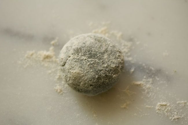small dough ball dusted with flour. 
