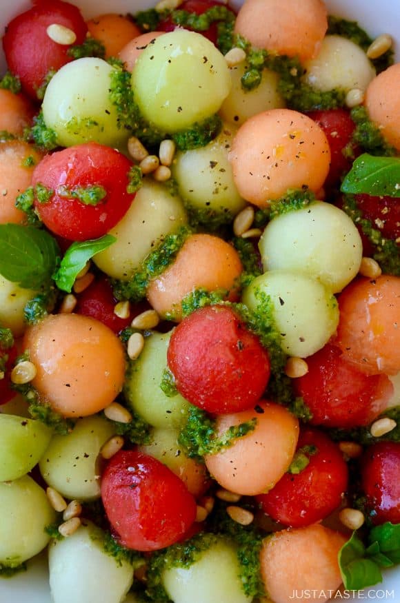 Closeup view of easy melon salad with basil vinaigrette and pine nuts